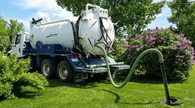 Professional vacuum truck performing residential drainage and septic maintenance in Hollywood, FL